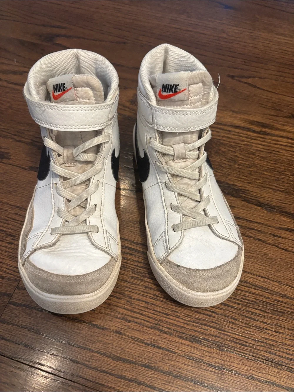 Nike Kids White and Black High-Top Sneakers with Orange Swoosh